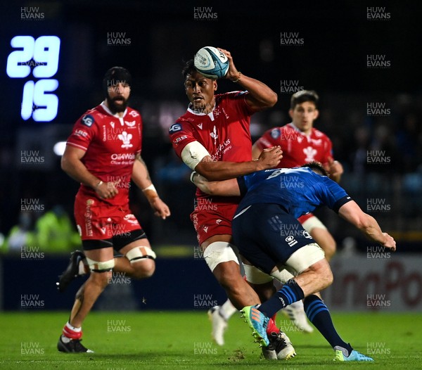 161021 - Leinster v Scarlets - United Rugby Championship - Sam Lousi of Scarlets is tackled by Jack Conan of Leinster