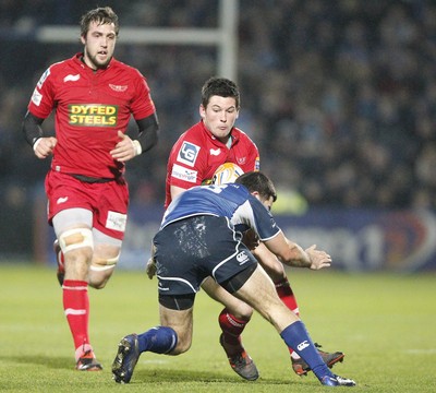 170212 - Leinster v Scarlets - RaboDirect Pro12 -Scarlets' Dan Newton is tackled by Leinster's Eoin O'Malley