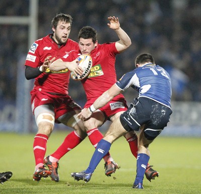 170212 - Leinster v Scarlets - RaboDirect Pro12 -Scarlets' Dan Newton is tackled by Leinster's Eoin O'Malley