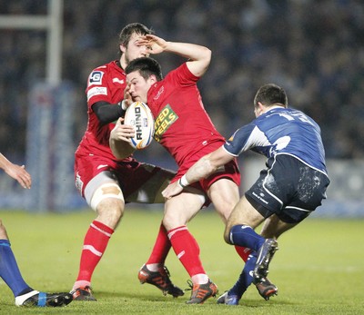 170212 - Leinster v Scarlets - RaboDirect Pro12 -Scarlets' Dan Newton is tackled by Leinster's Eoin O'Malley