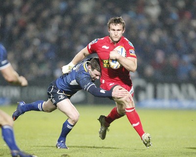 170212 - Leinster v Scarlets - RaboDirect Pro12 -Scarlets' Andy Fenby is tackled by Leinster's Fergus McFadden