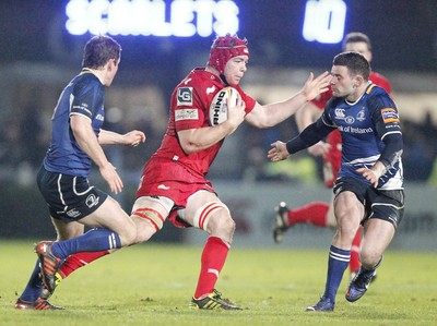 170212 - Leinster v Scarlets - RaboDirect Pro12 -Scarlets' Kiernan Murphy dodges the tackle of Leinster's Fergus McFadden