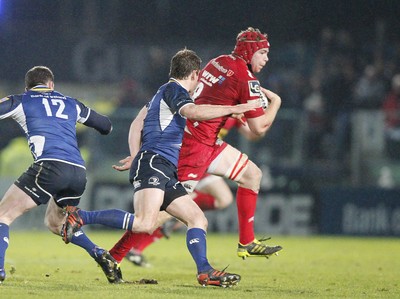 170212 - Leinster v Scarlets - RaboDirect Pro12 -Scarlets' Kiernan Murphy dodges the tackle of Leinster's Fergus McFadden