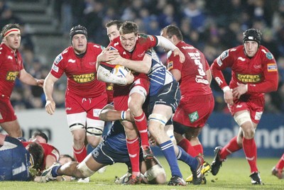 170212 - Leinster v Scarlets - RaboDirect Pro12 -Scarlets' Gareth Maule is tackled by Leinster's Devin Toner and Leo Auva'a