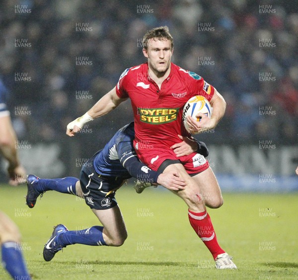 170212 - Leinster v Scarlets - RaboDirect Pro12 -Scarlets' Andy Fenby is tackled by Leinster's Fergus McFadden