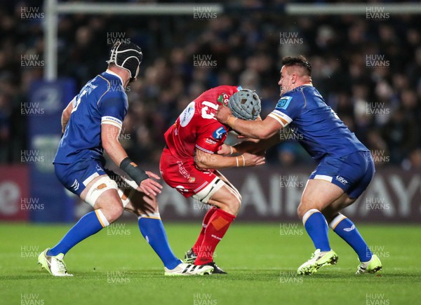 181123 - Leinster v Scarlets - United Rugby Championship - Jonathan Davies of Scarlets is tackled by Thomas Clarkson of Leinster