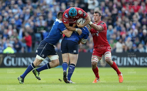 190517 - Leinster v Scarlets - Guinness PRO12 Semi Final - Tadhg Beirne of Scarlets is tackled by Jack Conan and James Tracy of Leinster