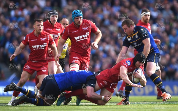 210418 - Leinster v Scarlets - European Rugby Champions Cup Semi Final - Leigh Halfpenny of Scarlets is tackled by James Ryan of Leinster
