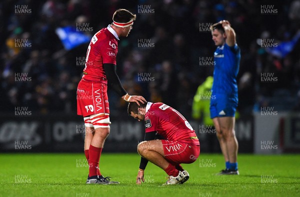 250119 - Leinster v Scarlets - Guinness PRO14 -  Ed Kennedy of Scarlets consoles team-mate Paul Asquith, right