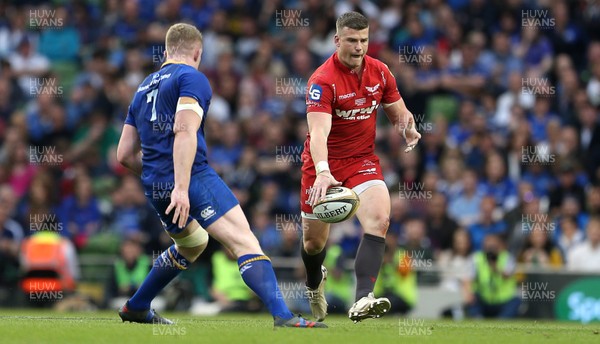 260518 - Leinster v Scarlets - Guinness PRO14 Final - Scott Williams of Scarlets is challenged by Dan Leavy of Leinster