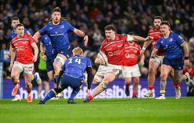 270326 - Leinster v Scarlets - United Rugby Championship - Fletcher Anderson of Scarlets is tackled by Tommy O'Brien of Leinster 