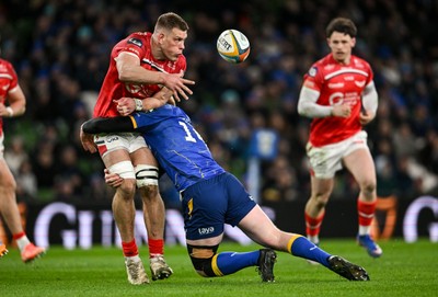 270326 - Leinster v Scarlets - United Rugby Championship - Jarrod Taylor of Scarlets is tackled by Tommy O'Brien of Leinster