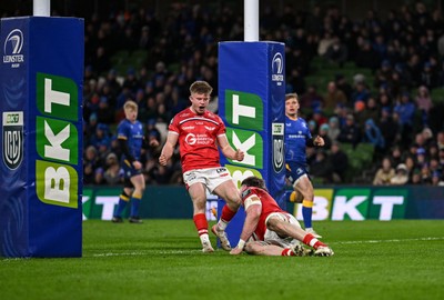 270326 - Leinster v Scarlets - United Rugby Championship - Archie Hughes of Scarlets celebrates after Max Douglas of Scarlets scores a try