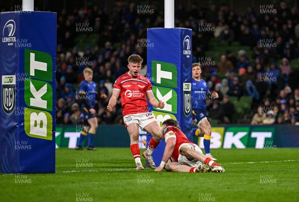 270326 - Leinster v Scarlets - United Rugby Championship - Archie Hughes of Scarlets celebrates after Max Douglas of Scarlets scores a try