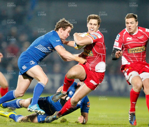 30/11/13 - Leinster v Scarlets - RaboDirect Pro 12Aled Thomas of Scarlets is tackled by Eoin Reddan and Ian Madigan of Leinster (c) Huw Evans Picture Agency