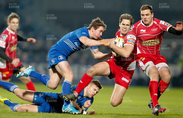 30/11/13 - Leinster v Scarlets - RaboDirect Pro 12Aled Thomas of Scarlets is tackled by Eoin Reddan and Ian Madigan of Leinster (c) Huw Evans Picture Agency