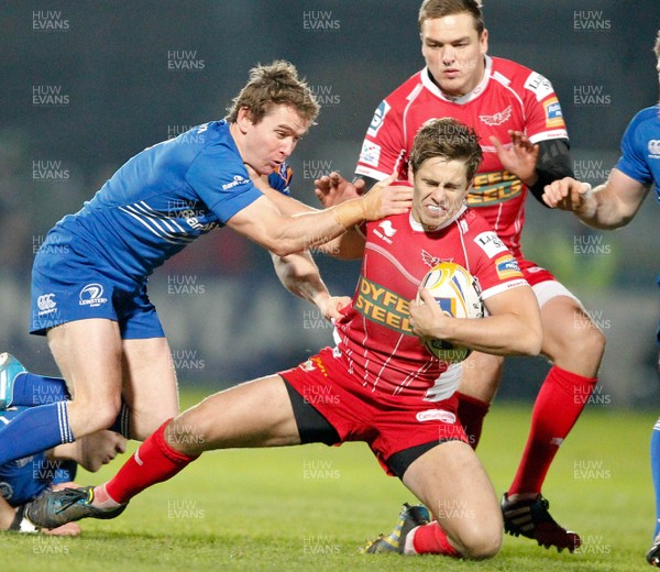 30/11/13 - Leinster v Scarlets - RaboDirect Pro 12Aled Thomas of Scarlets is tackled by Eoin Reddan and Ian Madigan of Leinster (c) Huw Evans Picture Agency