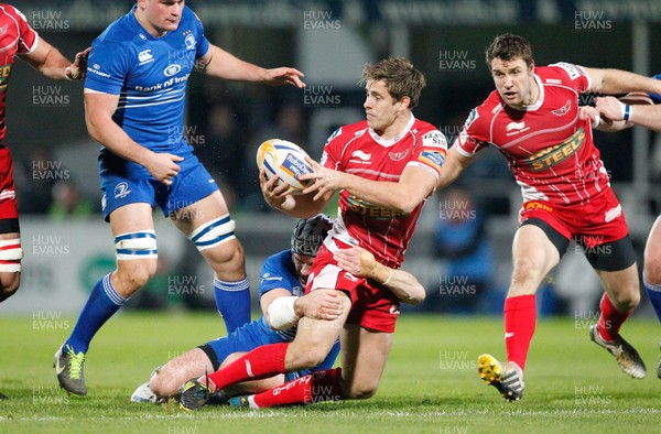 30/11/13 - Leinster v Scarlets - RaboDirect Pro 12Aled Thomas of Scarlets is tackled by Shane Jennings of Leinster (c) Huw Evans Picture Agency