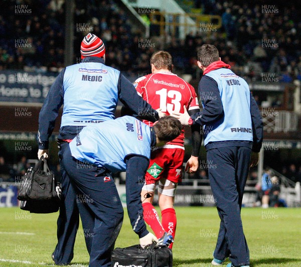 30/11/13 - Leinster v Scarlets - RaboDirect Pro 12Gareth Maule of Scarlets is led off the field injured (c) Huw Evans Picture Agency