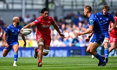 310525 - Leinster v Scarlets - United Rugby Championship Quarter-Final - Sam Lousi of Scarlets in action against Sam Prendergast of Leinster