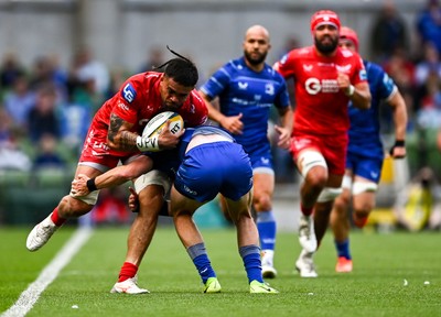310525 - Leinster v Scarlets - United Rugby Championship Quarter-Final - Vaea Fifita of Scarlets is tackled by Hugo Keenan of Leinster