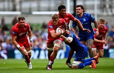310525 - Leinster v Scarlets - United Rugby Championship Quarter-Final - Taine Plumtree of Scarlets in action against James Ryan of Leinster