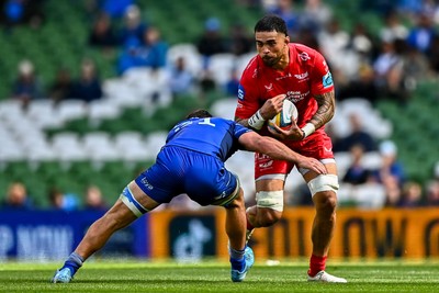 310525 - Leinster v Scarlets - United Rugby Championship Quarter-Final - Vaea Fifita of Scarlets is tackled by Scott Penny of Leinster