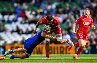 310525 - Leinster v Scarlets - United Rugby Championship Quarter-Final - Vaea Fifita of Scarlets is tackled by Scott Penny of Leinster