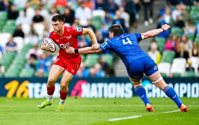 310525 - Leinster v Scarlets - United Rugby Championship Quarter-Final -  Joe Roberts of Scarlets in action against Joe McCarthy of Leinster