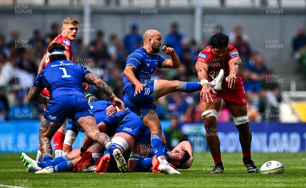 310525 - Leinster v Scarlets - United Rugby Championship Quarter-Final - Jamison Gibson-Park of Leinster has a kick blocked by Sam Lousi of Scarlets
