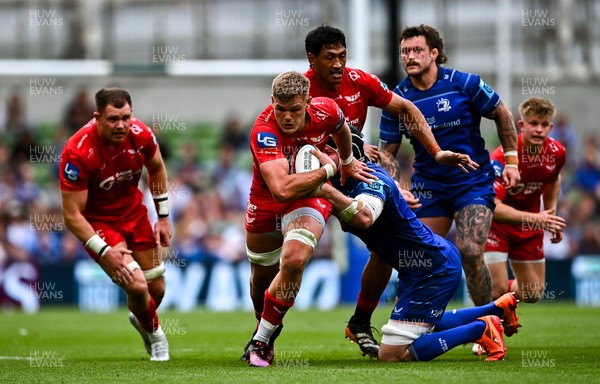 310525 - Leinster v Scarlets - United Rugby Championship Quarter-Final - Taine Plumtree of Scarlets in action against James Ryan of Leinster