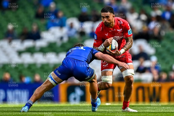310525 - Leinster v Scarlets - United Rugby Championship Quarter-Final - Vaea Fifita of Scarlets is tackled by Scott Penny of Leinster