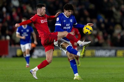 100126 - Leyton Orient v Cardiff City - Sky Bet League 1 - Yousef Salech of Cardiff City and Dan Happe of Leyton Orient battle for the ball