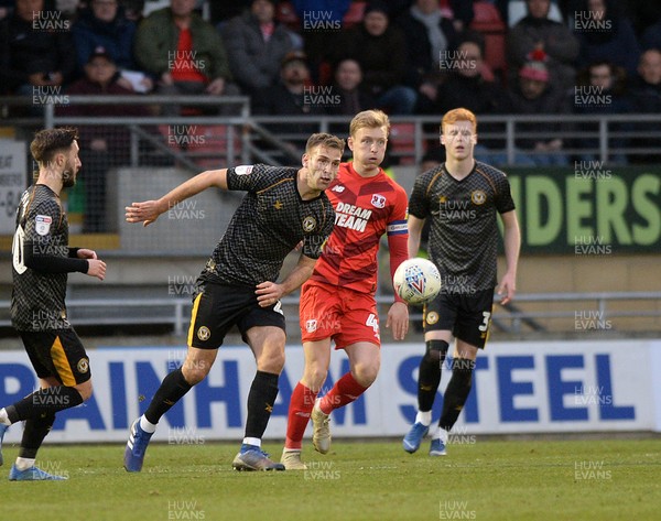 250120 - Leyton Orient v Newport County - Sky Bet League 2 -  Mickey Demetriou clears for Newport watched by Josh Wright of Orient