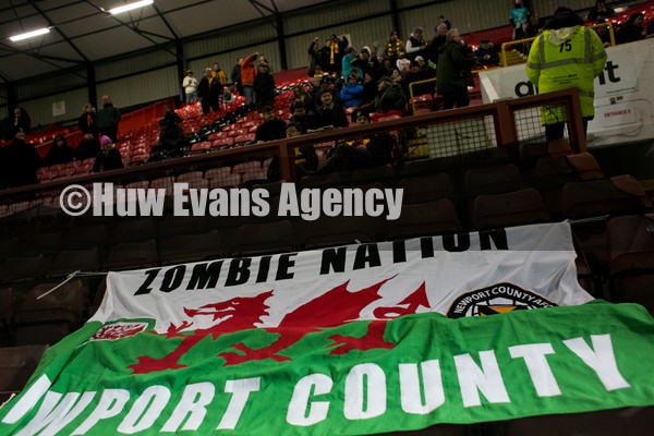 250122 - Leyton Orient v Newport County - Sky Bet League 2 - Newport County fans with Welsh flag
