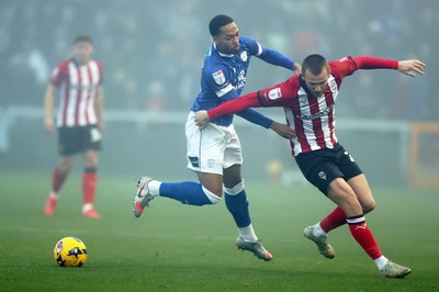 201225 - Lincoln City v Cardiff City - Sky Bet League 1 - Chris Willock of Cardiff and Tom Hamer of Lincoln