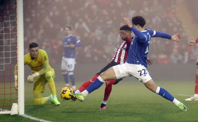 201225 - Lincoln City v Cardiff City - Sky Bet League 1 - Yousef Saleh of Cardiff nearly scores a goal but deflected by Reeco Hackett of Lincoln