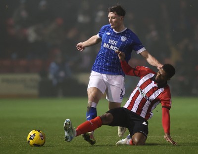 201225 - Lincoln City v Cardiff City - Sky Bet League 1 - Will Fish of Cardiff and Justin Obikwu of Lincoln