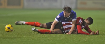 201225 - Lincoln City v Cardiff City - Sky Bet League 1 - Will Fish of Cardiff and Justin Obikwu of Lincoln