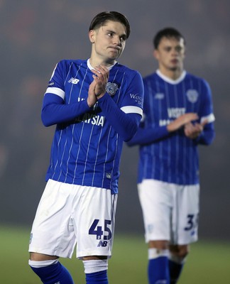 201225 - Lincoln City v Cardiff City - Sky Bet League 1 - Cian Ashford of Cardiff and Perry Ng of Cardiff applaud the travelling fans at the end of the match