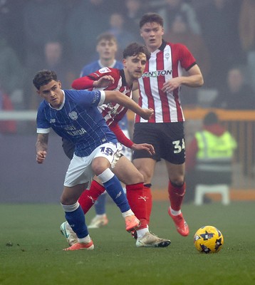 201225 - Lincoln City v Cardiff City - Sky Bet League 1 - Alex Robertson of Cardiff and Tom Bayliss of Lincoln