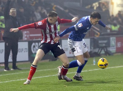 201225 - Lincoln City v Cardiff City - Sky Bet League 1 - Perry Ng of Cardiff and Jack Moylan of Lincoln