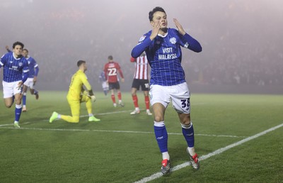 201225 - Lincoln City v Cardiff City - Sky Bet League 1 - Perry Ng of Cardiff celebrates Cardiff’s only goal and blows kisses to the fans