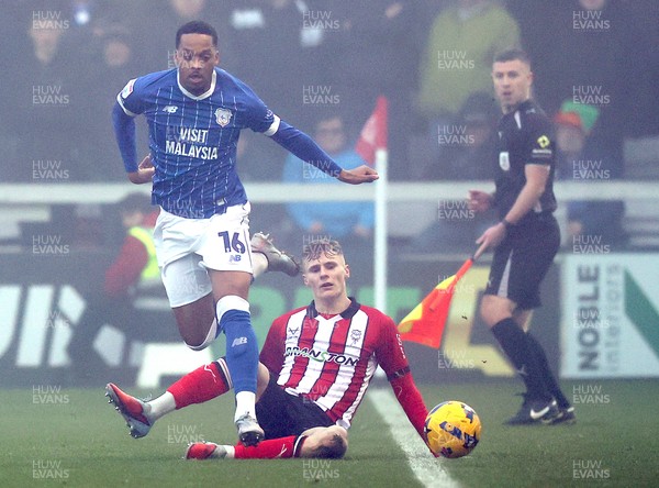 201225 - Lincoln City v Cardiff City - Sky Bet League 1 - Chris Willock of Cardiff and Rob Street of Lincoln