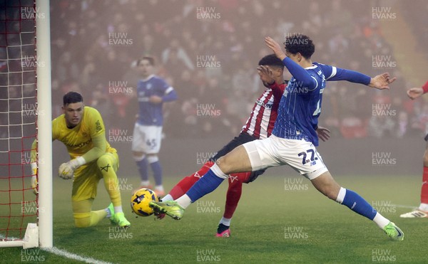 201225 - Lincoln City v Cardiff City - Sky Bet League 1 - Yousef Saleh of Cardiff nearly scores a goal but deflected by Reeco Hackett of Lincoln