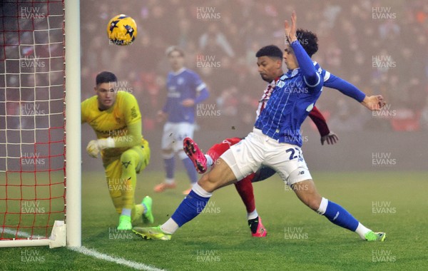 201225 - Lincoln City v Cardiff City - Sky Bet League 1 - Yousef Saleh of Cardiff nearly scores a goal but deflected by Reeco Hackett of Lincoln