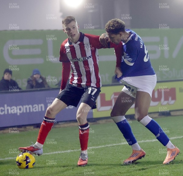 201225 - Lincoln City v Cardiff City - Sky Bet League 1 - Omari Kellyman of Cardiff is grabbed by Rob Street of Lincoln