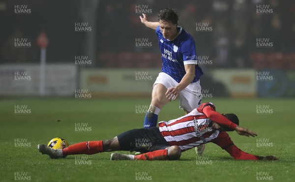 201225 - Lincoln City v Cardiff City - Sky Bet League 1 - Will Fish of Cardiff and Justin Obikwu of Lincoln
