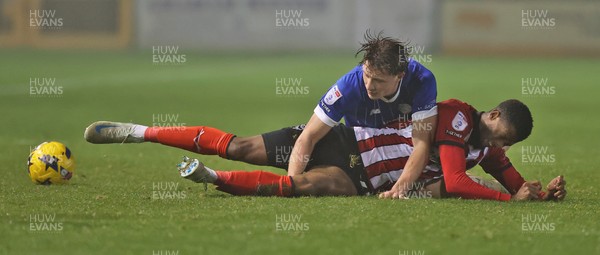 201225 - Lincoln City v Cardiff City - Sky Bet League 1 - Will Fish of Cardiff and Justin Obikwu of Lincoln
