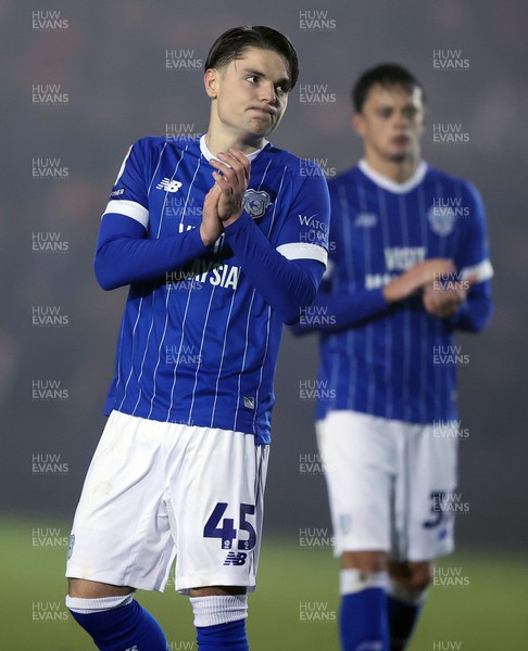 201225 - Lincoln City v Cardiff City - Sky Bet League 1 - Cian Ashford of Cardiff and Perry Ng of Cardiff applaud the travelling fans at the end of the match